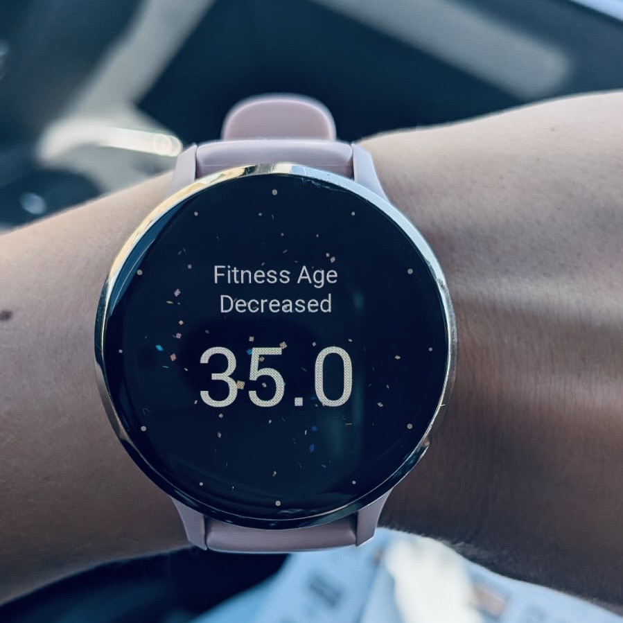 Ashley's watch showing her fitness age dropping from 39 to 35