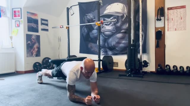 Forearm plank shoulder taps
