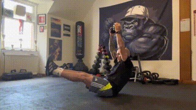 Hollow hold dumbbell reach
