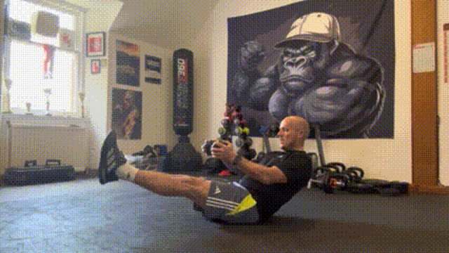 Hollow hold with dumbbell