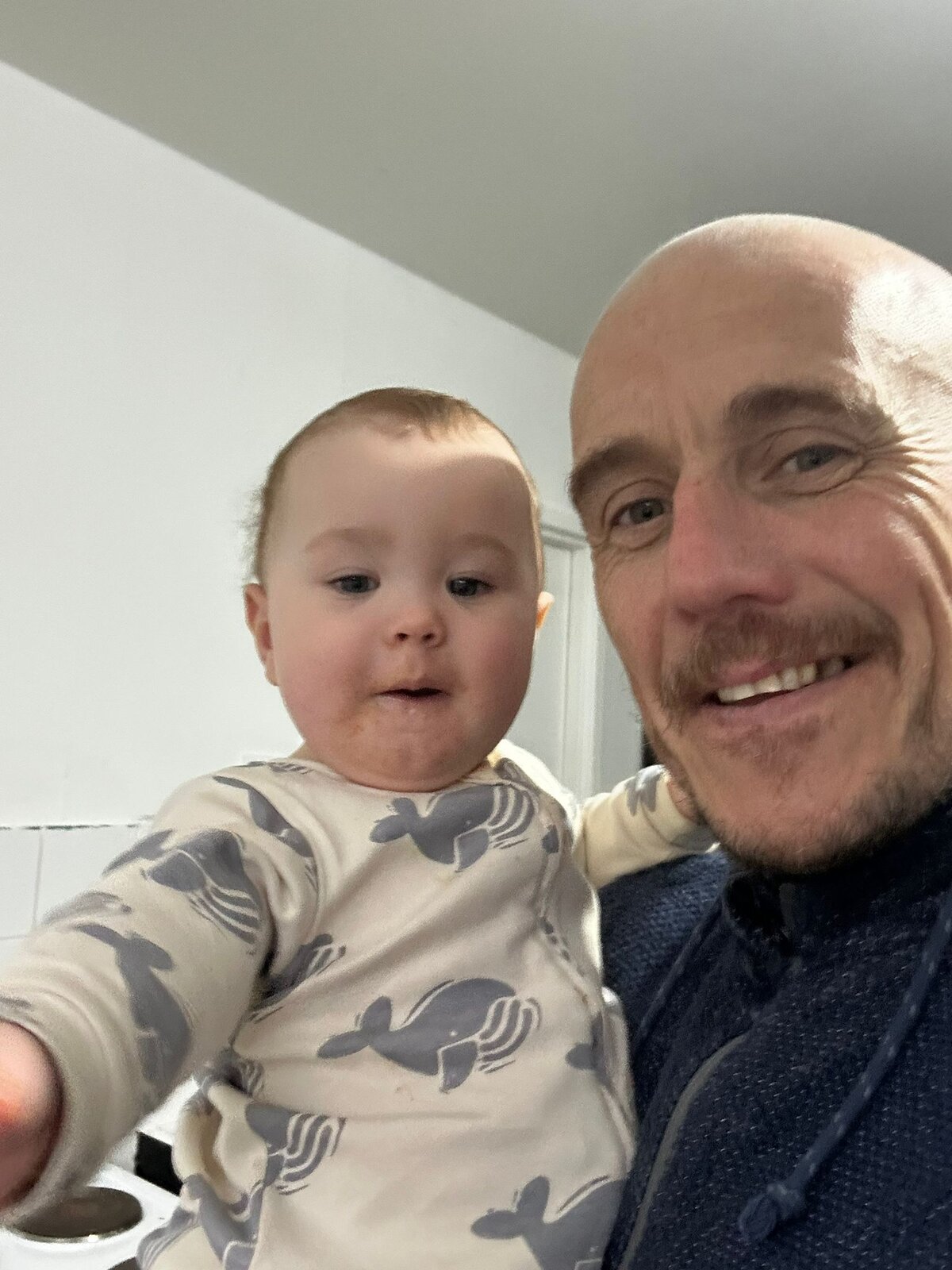 Parent lifting child - everyday core strength in action