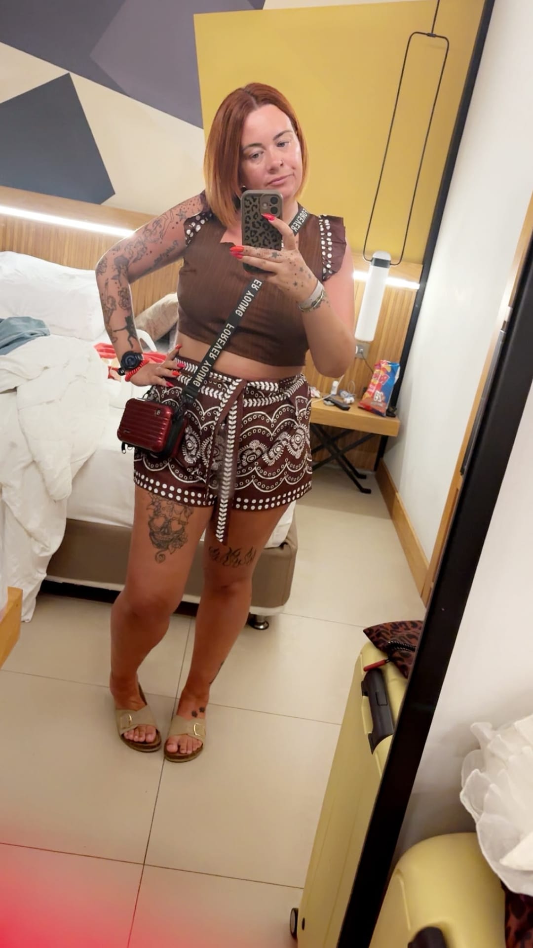 Sarah in a hotel room mirror, dressed for the evening
